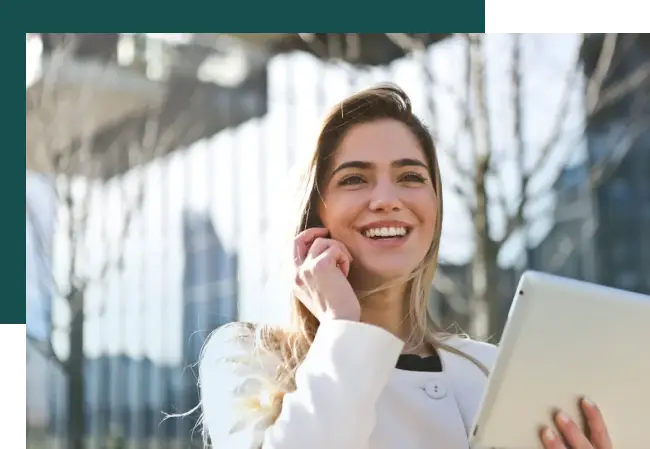 woman smiling and talking on phone